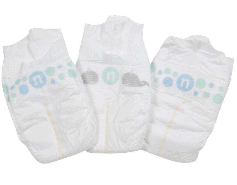 Three white diapers with blue and green dots and a whale