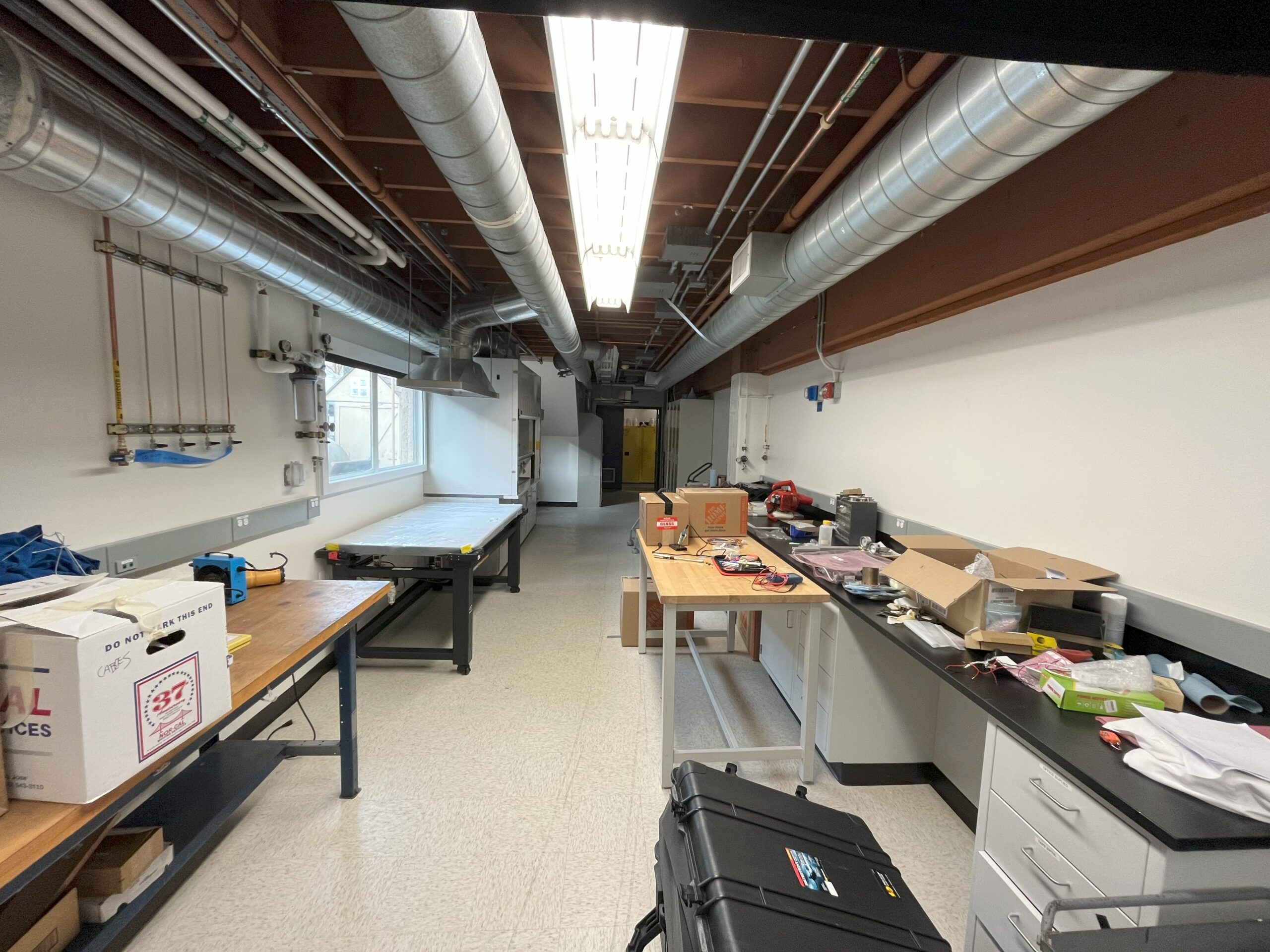 Photo of lab with reused benches and storage from decommissioned labs